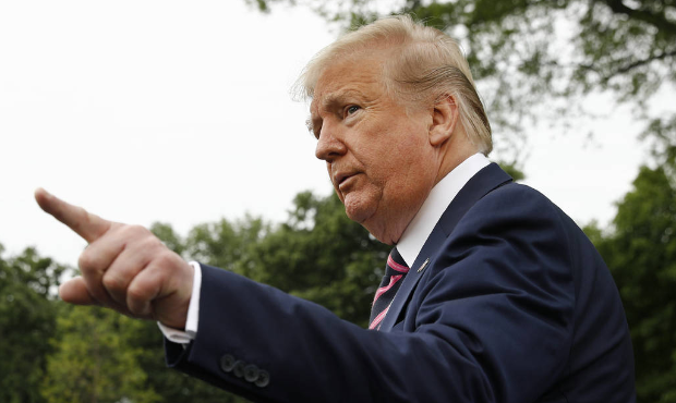President Donald Trump speaks to members of the media on the South Lawn of the White House in Washi...