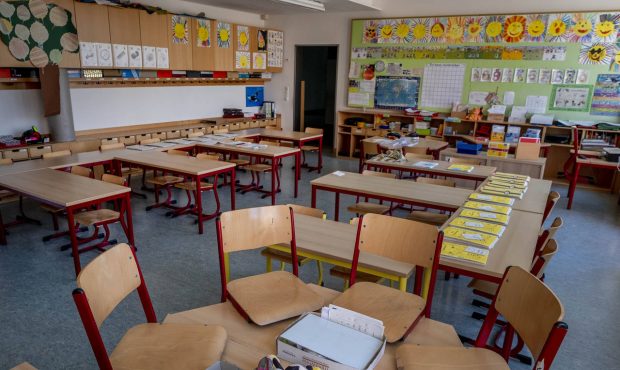 An empty classroom is seen in an elementary school in Frankfurt, Germany, Monday, April 20, 2020. D...