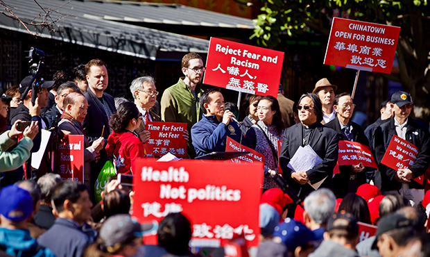Protesters speak out against racism amid the COVID-19 pandemic during a demonstration Feb. 29, 2020...