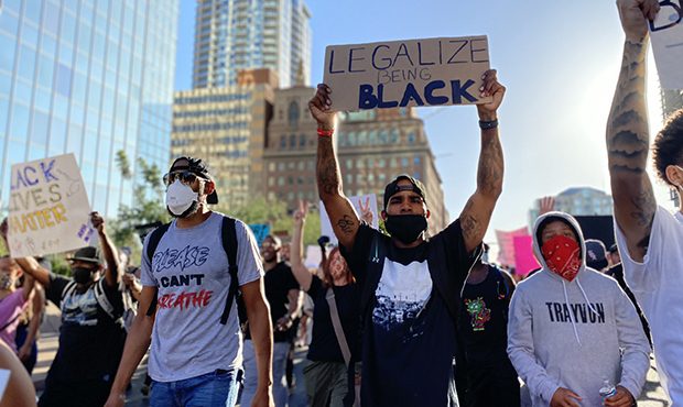Protestors march in downtown Phoenix on June 6, 2020. (KTAR Photo/Gabriel Gamiño)...
