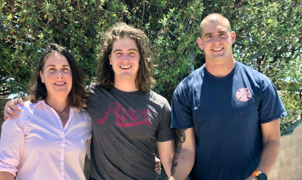 (Photo of Ian Youngblood with his mother and brother)...