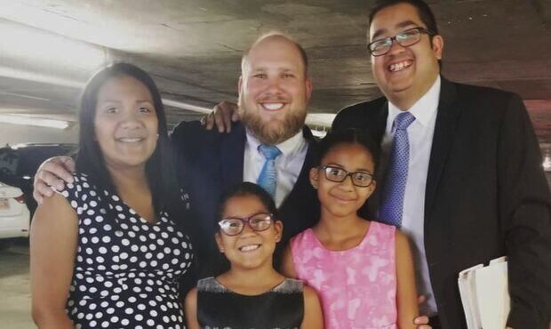 Josh Holt and his family celebrate the finalization of the legal process to allow daughters Marian ...
