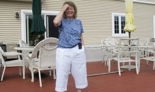In this Aug. 24, 2020, photo Jean Grady smiles as she poses at her home in Westford, Vt. Grady wear...