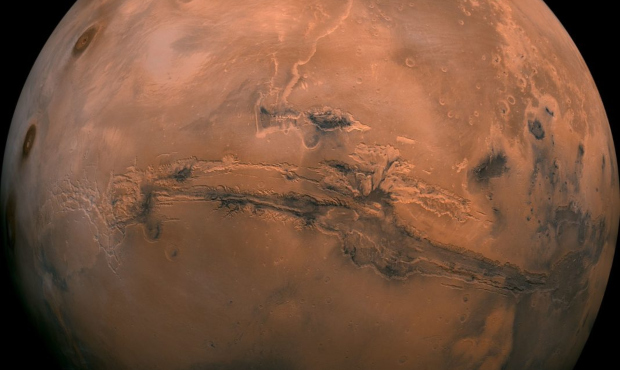 A composite photo was created from over 100 images of Mars taken by Viking Orbiters in the 1970s. (...
