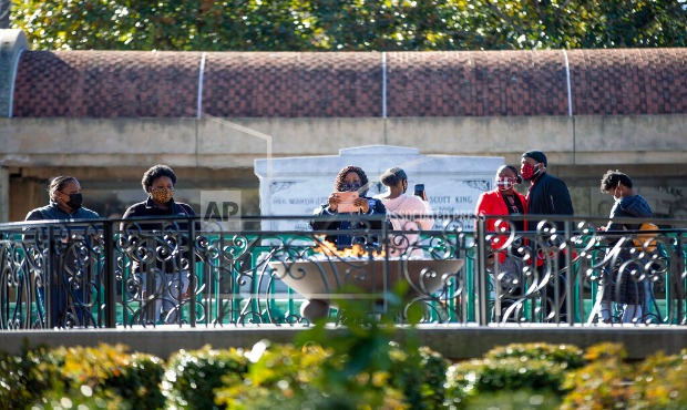People visit the eternal flame at the tomb of Rev. Martin Luther King Jr. and his wife Coretta Scot...