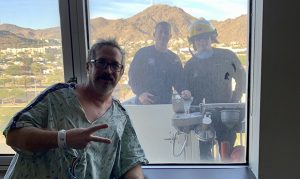 Phoenix firefighter hospitalized with COVID-19, visited by crew