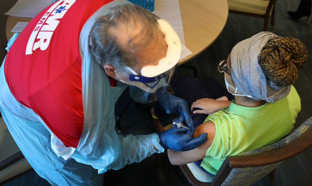 A healthcare worker with American Medical Response, Inc working with the Florida Department of Heal...