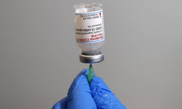 An air force medical staff prepares a dose of Moderna COVID-19 vaccine at the vaccination mega cent...