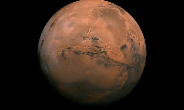 This image made available by NASA shows the planet Mars. This composite photo was created from over...