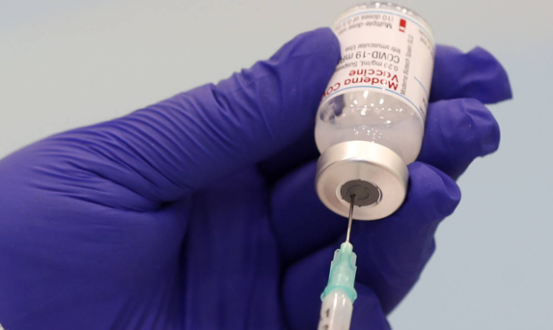 A healthcare worker prepares a Moderna COVID-19 vaccine at a sports hall in Ricany, Czech Republic,...