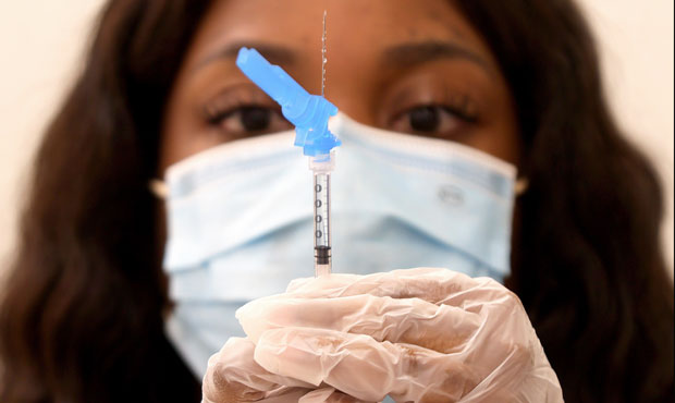 A dose of the new one-shot Johnson & Johnson COVID-19 vaccine is prepared at a vaccination event at...