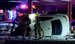 Passenger dies after speeding car rolls over, catches fire in Peoria