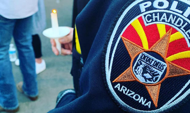 Chandler Police held a candlelight vigil Saturday in memory of fallen Officer Christopher Farrar, w...