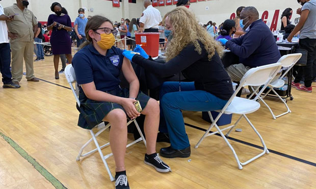 Arizona Department of Health Services Director Dr. Cara Christ administers the COVID-19 vaccine at ...