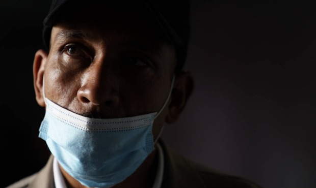 Domingo Antonio Zeledon, 39, of Nicaragua, looks out from a migrant shelter, Wednesday, May 12, 202...