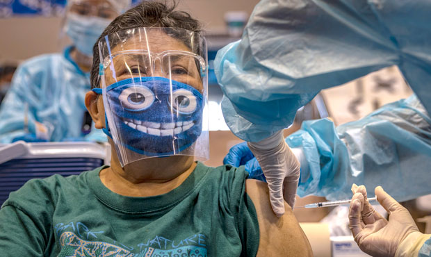 A woman is administered with Russian Sputnik V COVID-19 vaccine at a sports arena on May 4, 2021 in...
