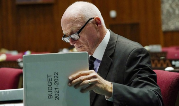 Arizona House Speaker Rusty Bowers, R-Mesa, looks over the printed budget prior to a vote on the Ar...