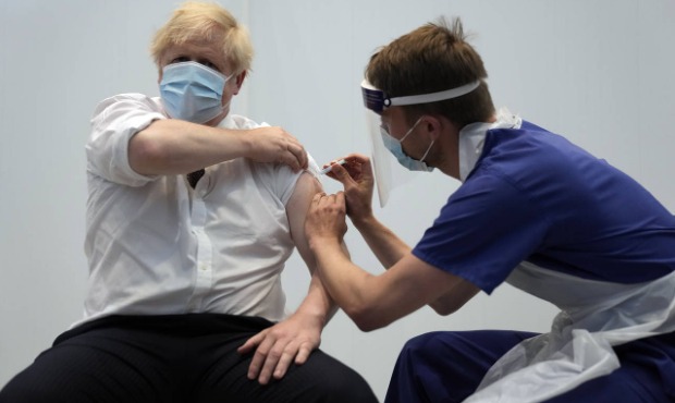 British Prime Minister Boris Johnson receives his second jab of the AstraZeneca coronavirus vaccine...