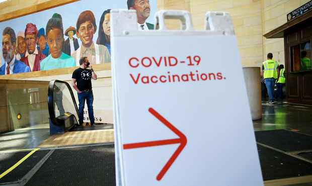 A sign points to a quiet vaccination site set up inside Union Station in an effort to target commut...