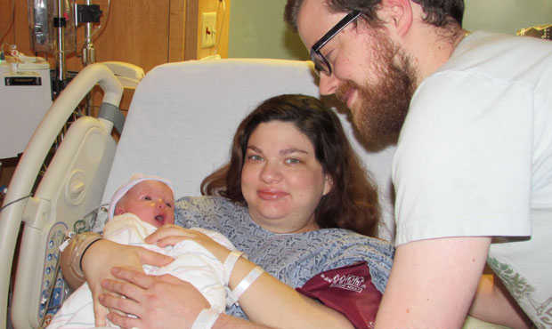 Danielle Edwards holds her daughter, Amelia, after giving birth in 2014. During her pregnancy, Edwa...