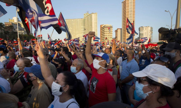 People attend a cultural-political event on the seaside Malecon Avenue with thousands of people in ...