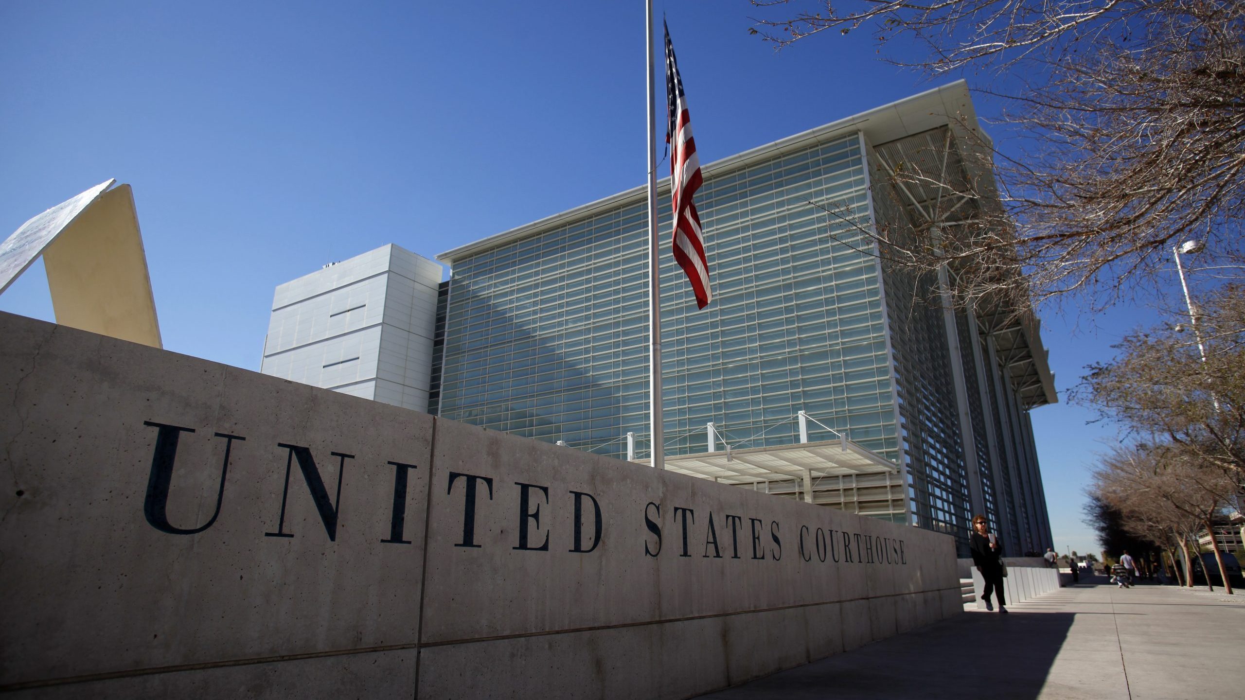 PHOENIX, AZ - JANUARY 24:  A flag flies outside the Sandra Day O'Connor federal courthouse January ...