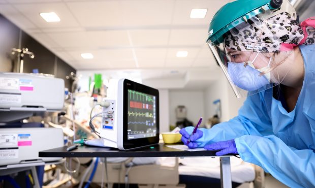 A clinician cares for COVID-19 patients in the Intensive Care Unit (ICU) at Lake Charles Memorial H...