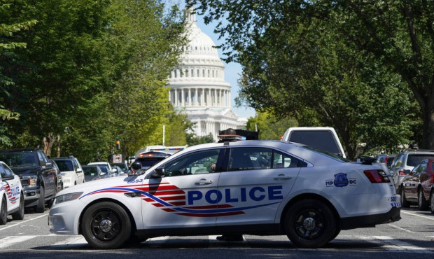 A Metropolitan Police Department cruiser blocks a street near the U.S. Capitol and a Library of Con...