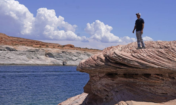 Bill Schneider stands near Antelope Point's public launch ramp off Lake Powell, which closed to hou...