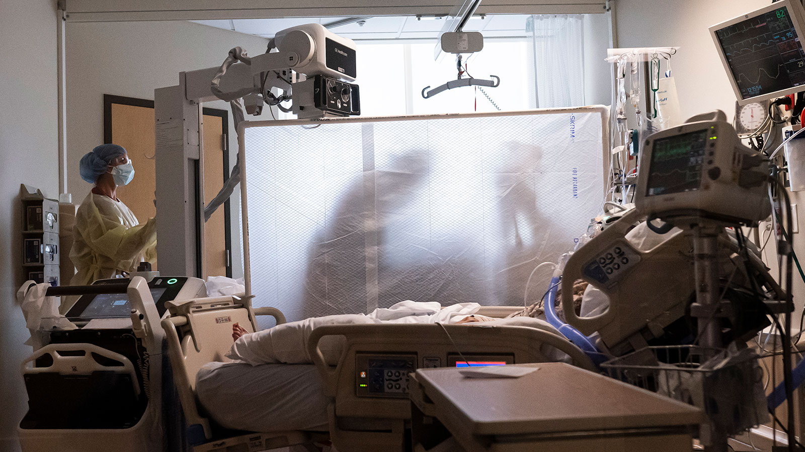 Medical staff in the COVID-19 Intensive Care Unit at Three Rivers Asante Medical Center perform a c...