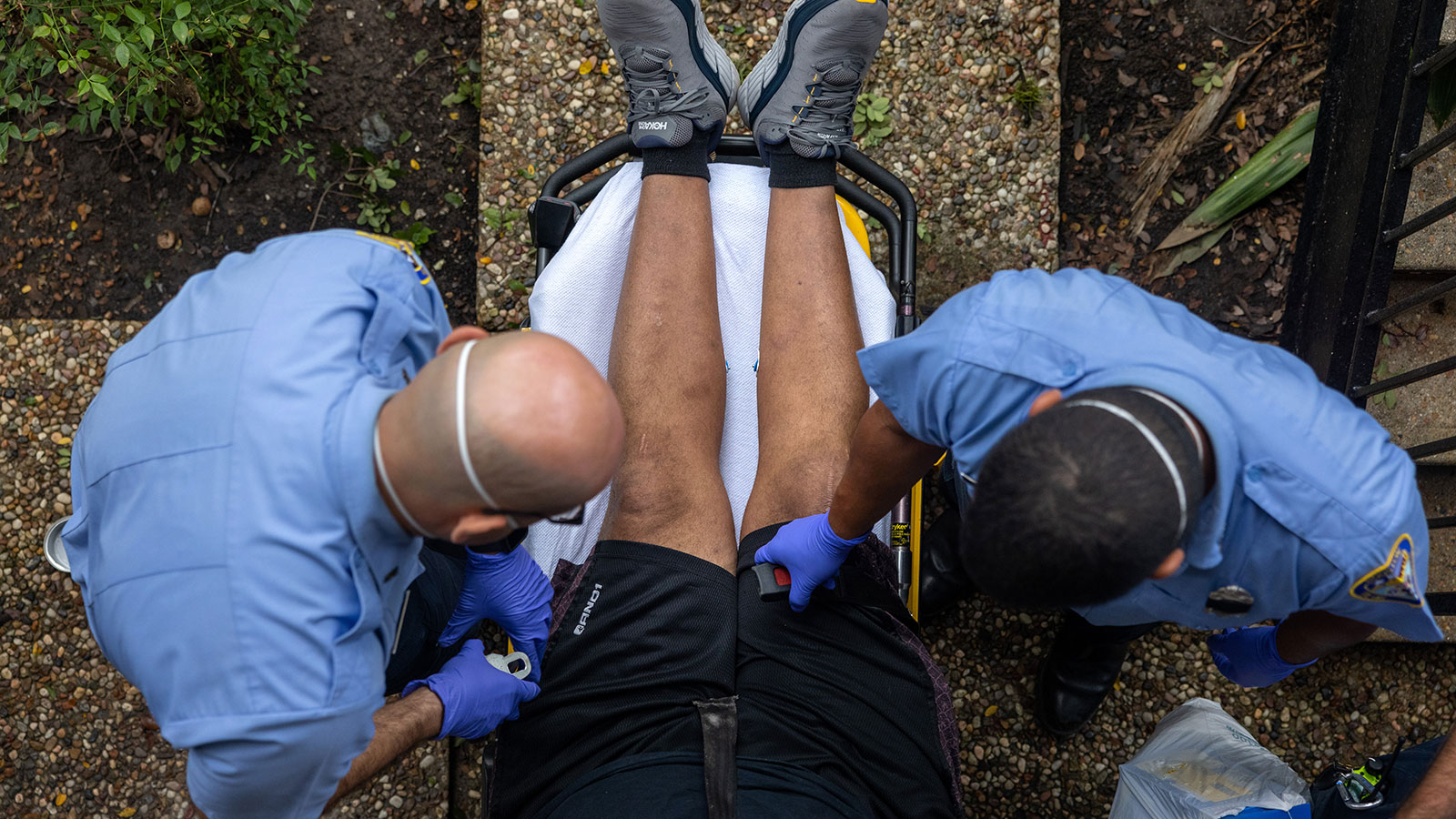 Houston Fire Department paramedics transport a man suffering from breathing difficulties to a hospi...