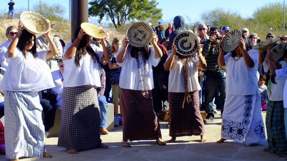 Salt River Traditional Dancers perform at an event while holding baskets in January 2013 at Mesa Gr...