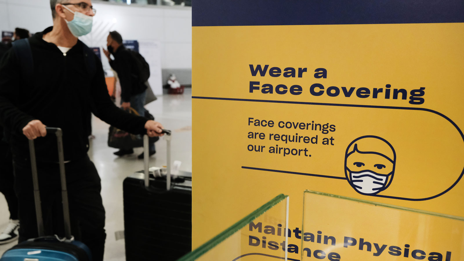 Travelers arrive from international flights at Newark Liberty International Airport on Nov. 30, 202...