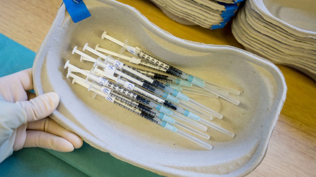 Tagreed Husain, Employee of the German Red Cross, prepares syringes with Moderna vaccine against Co...