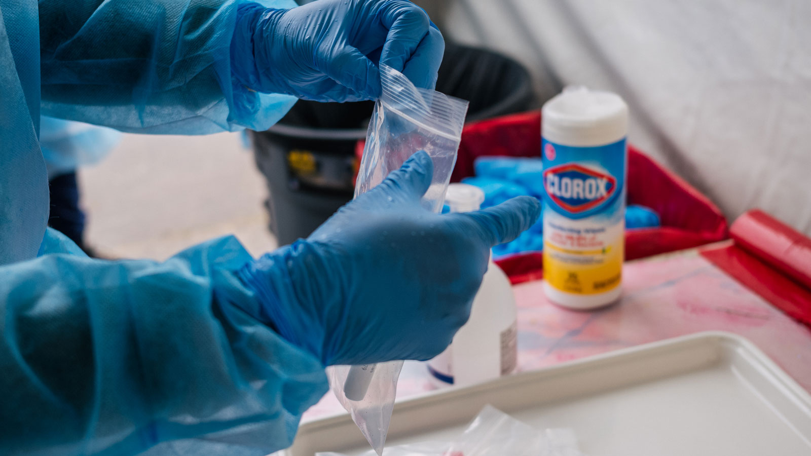 An Xpress Covid Testing medical secures a testing tube on Jan. 8, 2022, in Houston, Texas. (Photo b...