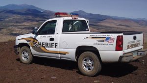 Man accused of driving through Arizona airport fence, holding family at gunpoint