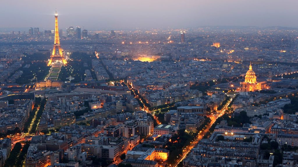 General view of Paris at dusk with the Eiffel Tower and  the Hotel des Invalides prominent on June ...