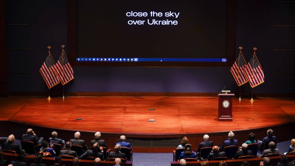 The words "close the sky over Ukraine" is displayed as Ukrainian President Volodymyr Zelenskyy spea...
