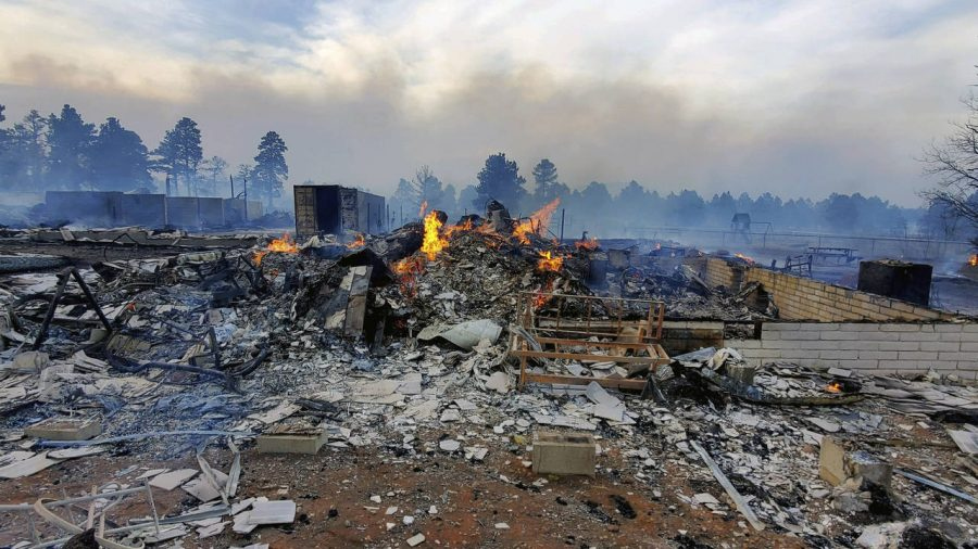 This Wednesday April 20, 2022, photo provided by Bill Wells shows his home on the outskirts of Flag...