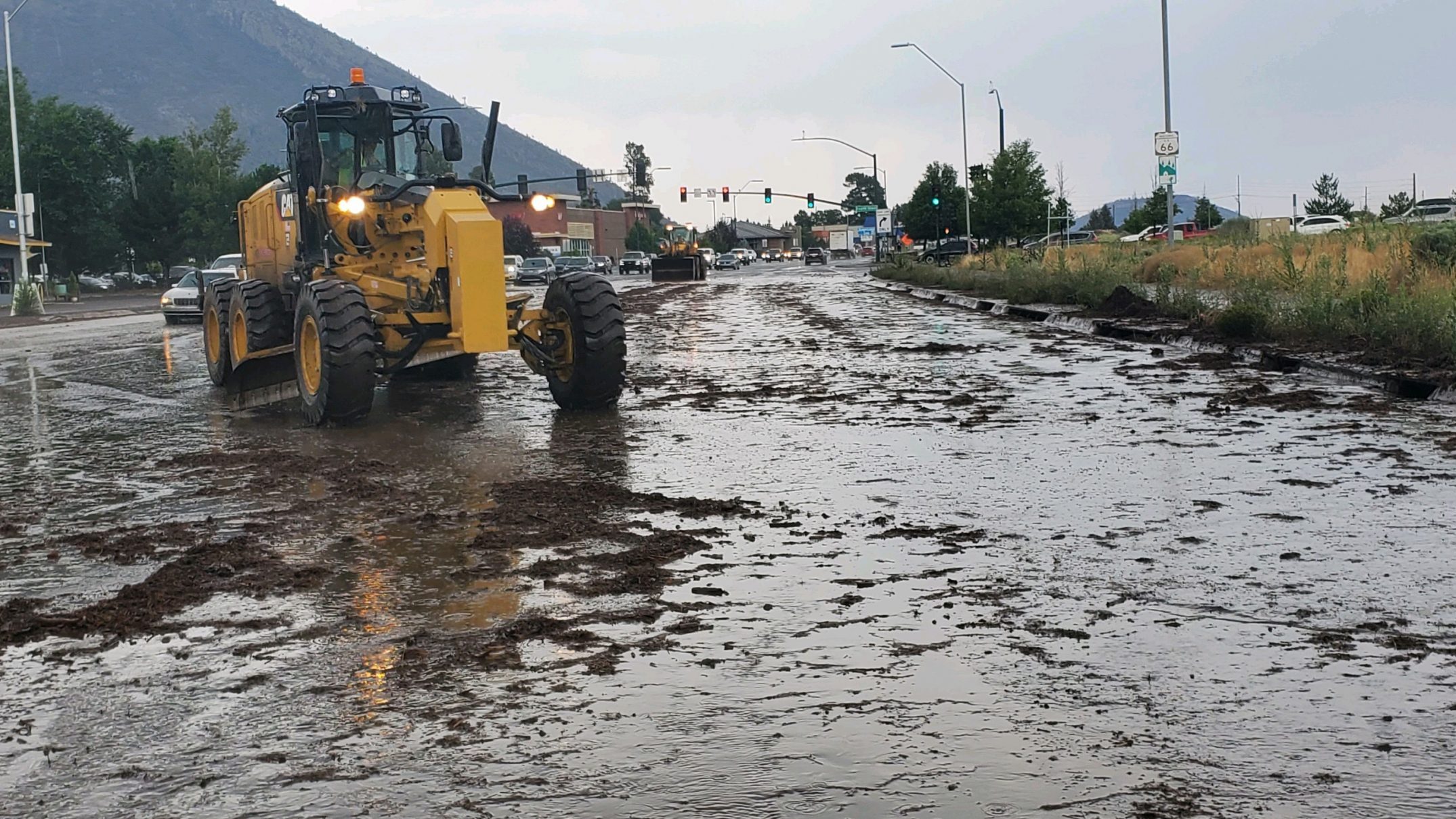 Mud and debris runoff from the 2019 Museum Fire burn scar is seen in Flagstaff near Route 66 on Wed...