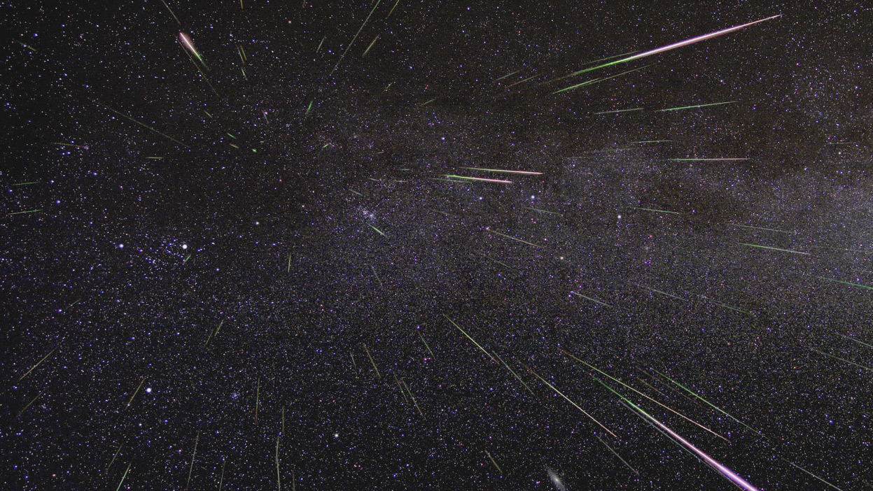 An outburst of Perseid meteors lights up the sky in August 2009 in this time-lapse image. (NASA/JPL...