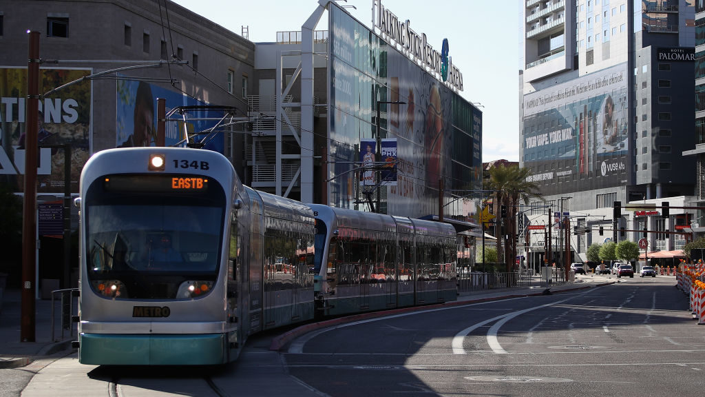 A Valley Metro Rail train drives through downtown on March 26, 2020 in Phoenix, Arizona. (Photo by ...