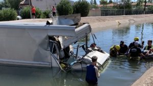 Mesa driver taken to hospital after vehicle strikes pole, crashes into canal
