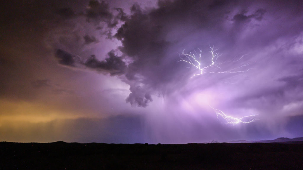 Lightning strikes during a monsoon storm on July 21, 2022 near Mayer, Arizona. The National Weather...