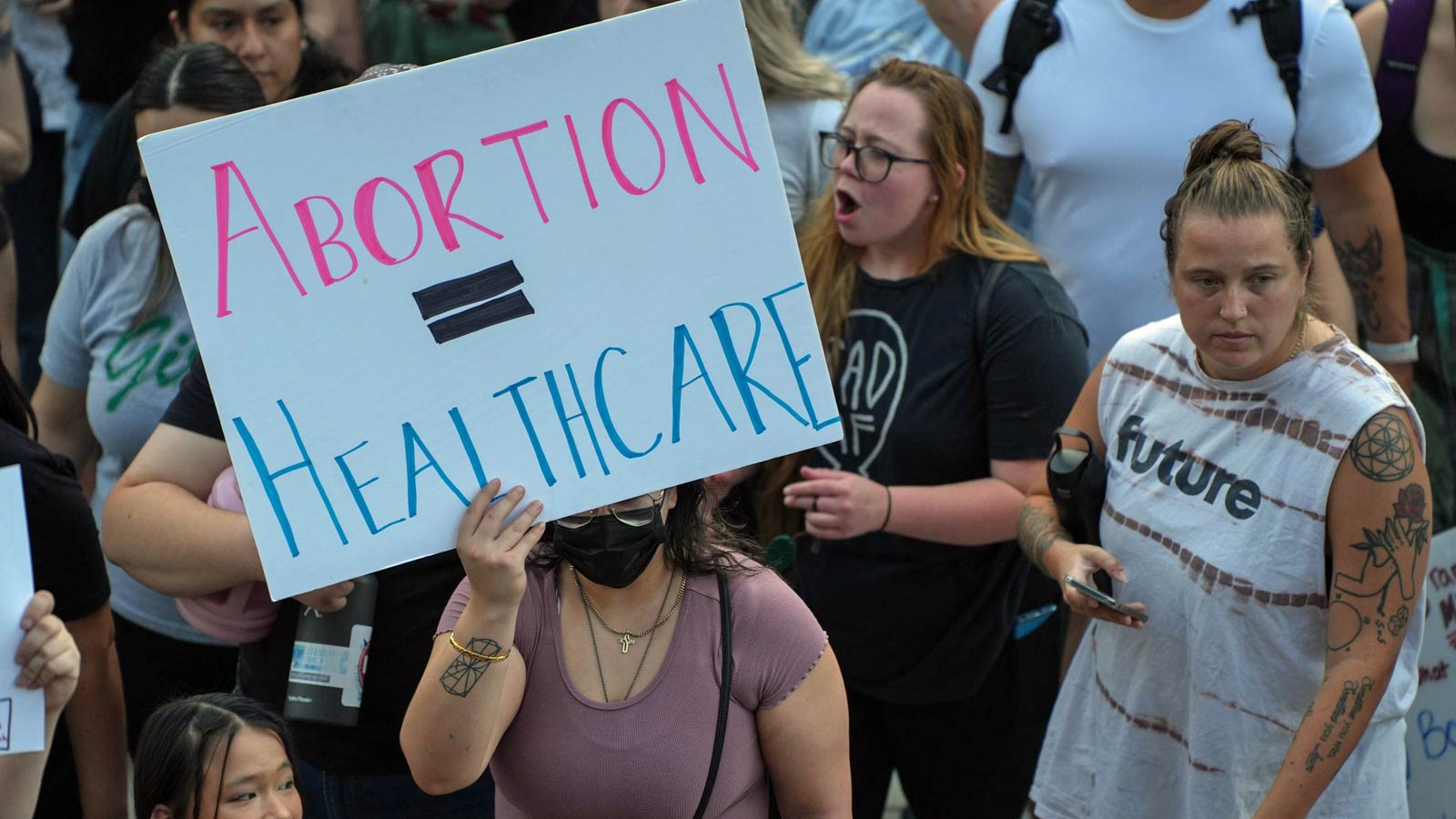 Activists in this file photo rally outside the Arizona Capitol in June, 2022, after the U.S. Suprem...