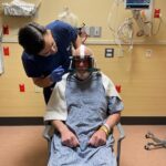 Dr. Francisco Ponce of Barrow Neurological Institute preps Jim Kurtz before his focused ultrasound treatment for essential tumor. 
