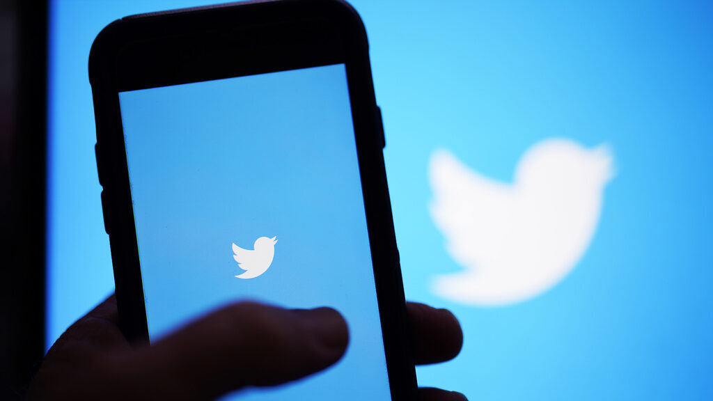 The Twitter application is seen on a digital device, April 25, 2022, in San Diego. Election adminis...
