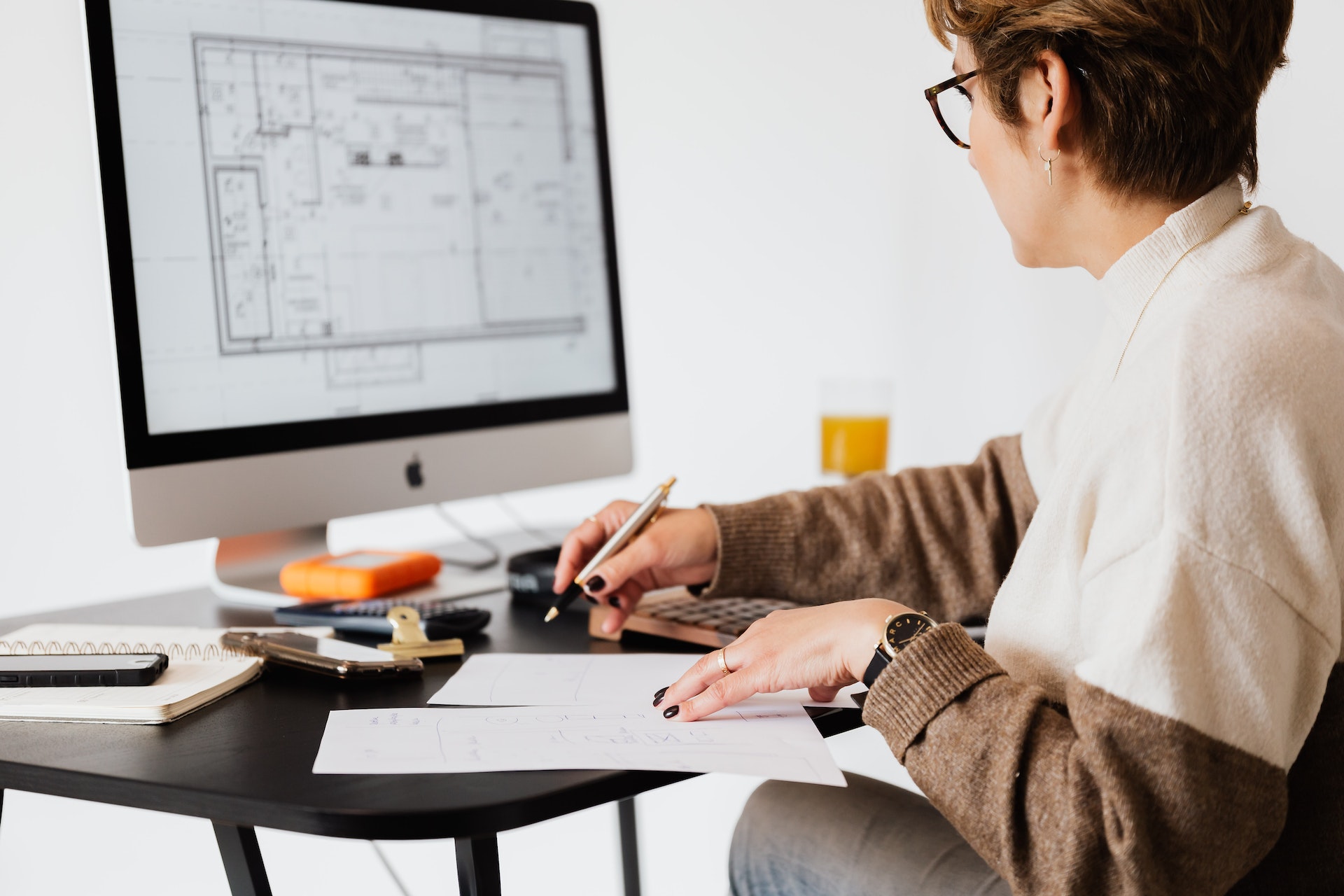 woman on computer looking at building plans...