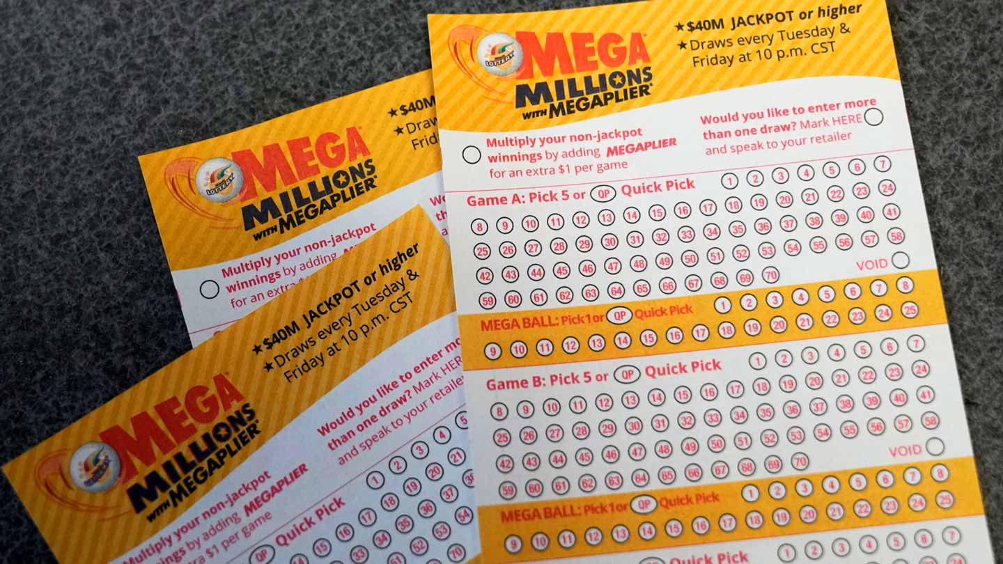 File photo of Mega Millions lottery game entry forms. Arizona had a eight of five-digit lottery win...