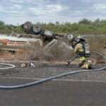 A semi-truck carrying fuel rolled over on Interstate 10 near Tonopah, Arizona, and started leaking on Tuesday, Aug. 22, 2023. 